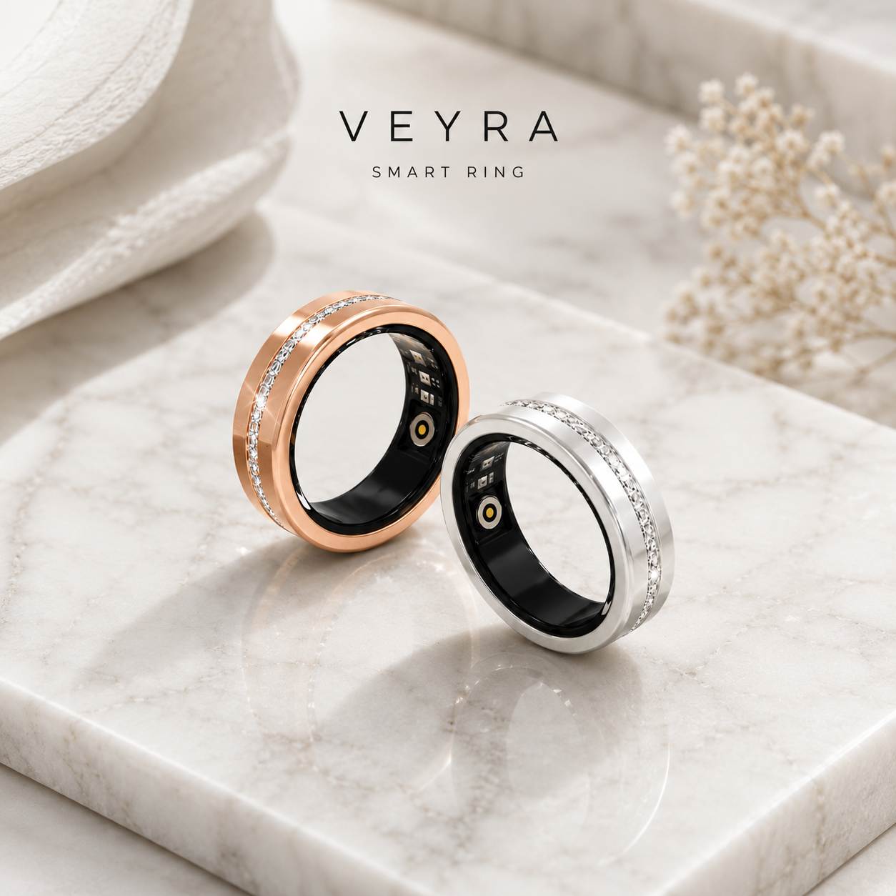 PULSE ONE Smart Ring von Veyra Health in Roségold und Silber mit Kristall-Band auf Marmor