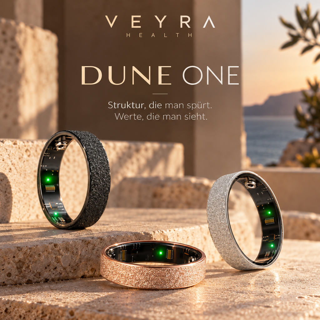 DUNE ONE von Veyra Health in Schwarz, Roségold und Silber auf Stein im warmen Abendlicht
